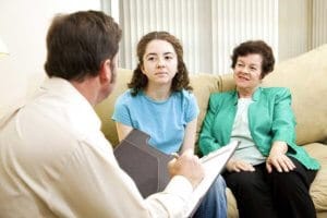 Young Woman and Her Mother Benefitting from Family Therapy