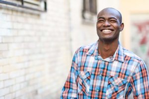 A man smiles because he is glad he went to one of the best alcohol treatment programs in Maryland